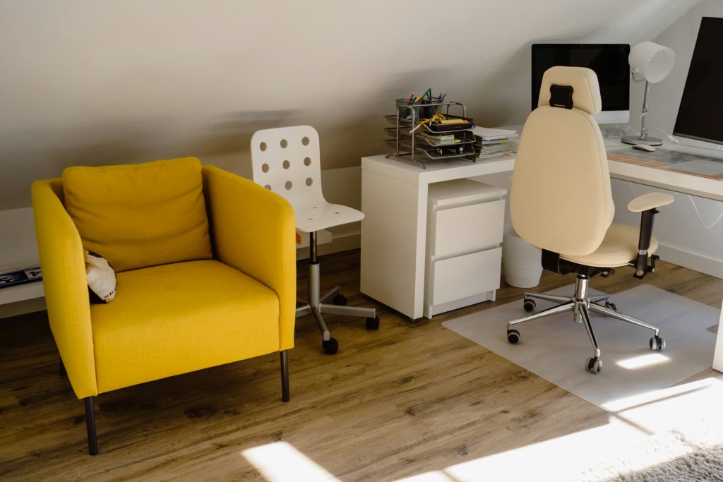 pexels photo 5644330 5644330 Bright home office with a yellow chair and organized desk setup.